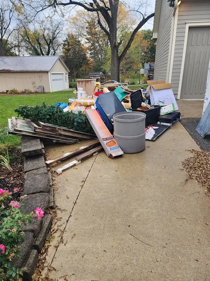 Dumpster being loaded with debris for 30 Yard Dumpster Rental in Medford Lakes